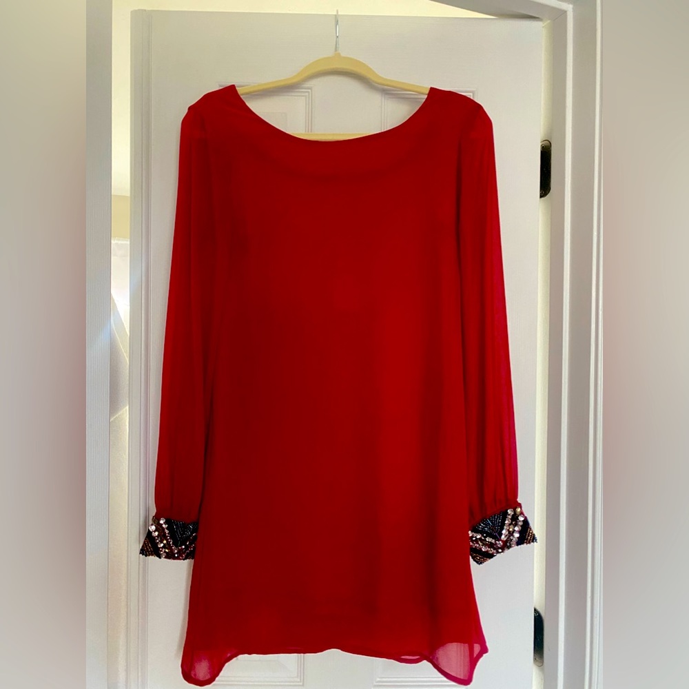 Red dress with rhinestone wrists. Zipper in the back.